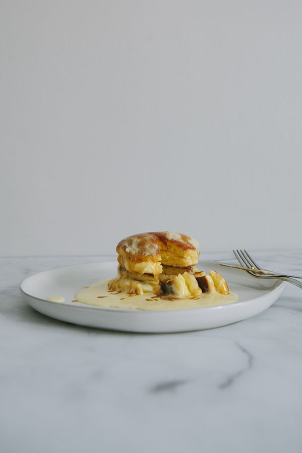 Japanese Soufflé Pancakes cut with custard cream and caramel sauce, knife and fork, Minnesota Food Photographer