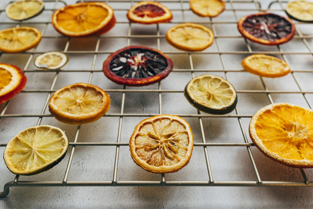 Oven dried oranges, blood oranges, lime, and lemon sitting on a cooling rack, Minneapolis, Chicago food photographer, Minnesota, Chicago commercial photography, product, St Paul photographer, Twin Cities, editorial photographers
