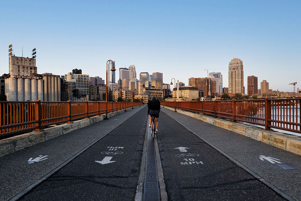 Stone Arch Bridge Morning Minneapolis, Minnesota with bicyclist. Chicago Photographers