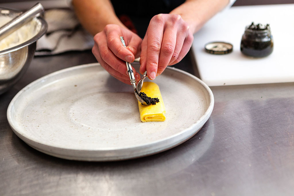 Gourmet egg and black caviar French omelette dish preparation, editorial food photography, Minneapolis food photographers, Midwest editorial food photography