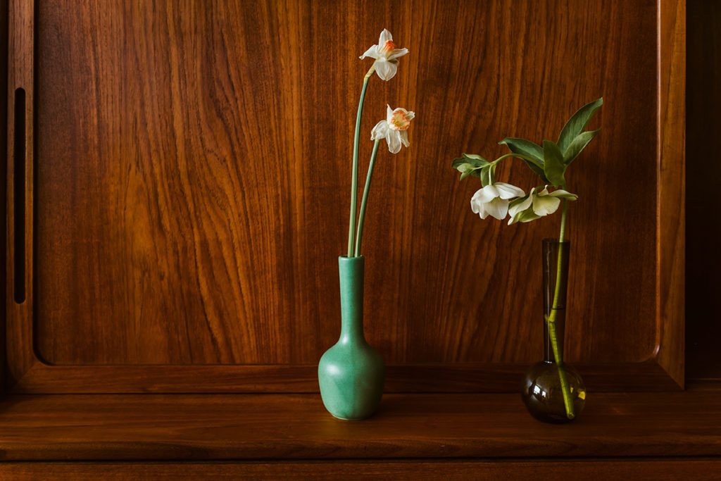 vases simple sophisticated dainty tulip white buttercup flowers wood cabinet moody dark vintage interior design studio Minneapolis MN Minnesota Twin Cities Floral flowers Saint Paul