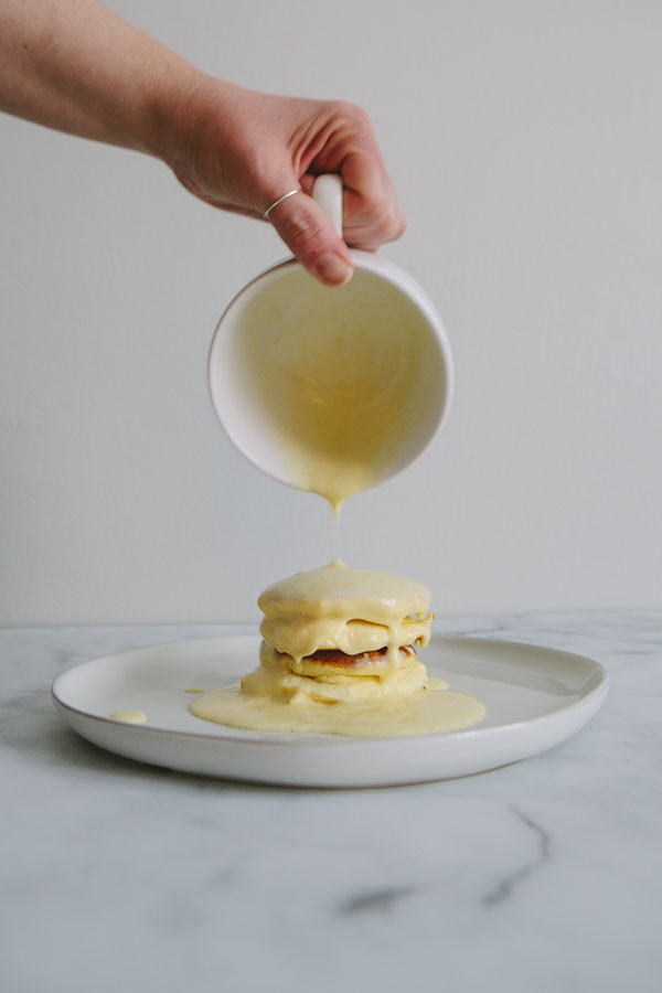 Japanese Soufflé Pancakes with custard cream being poured over the top, Minneapolis, Chicago Food Photographers, food photographers near Chicago