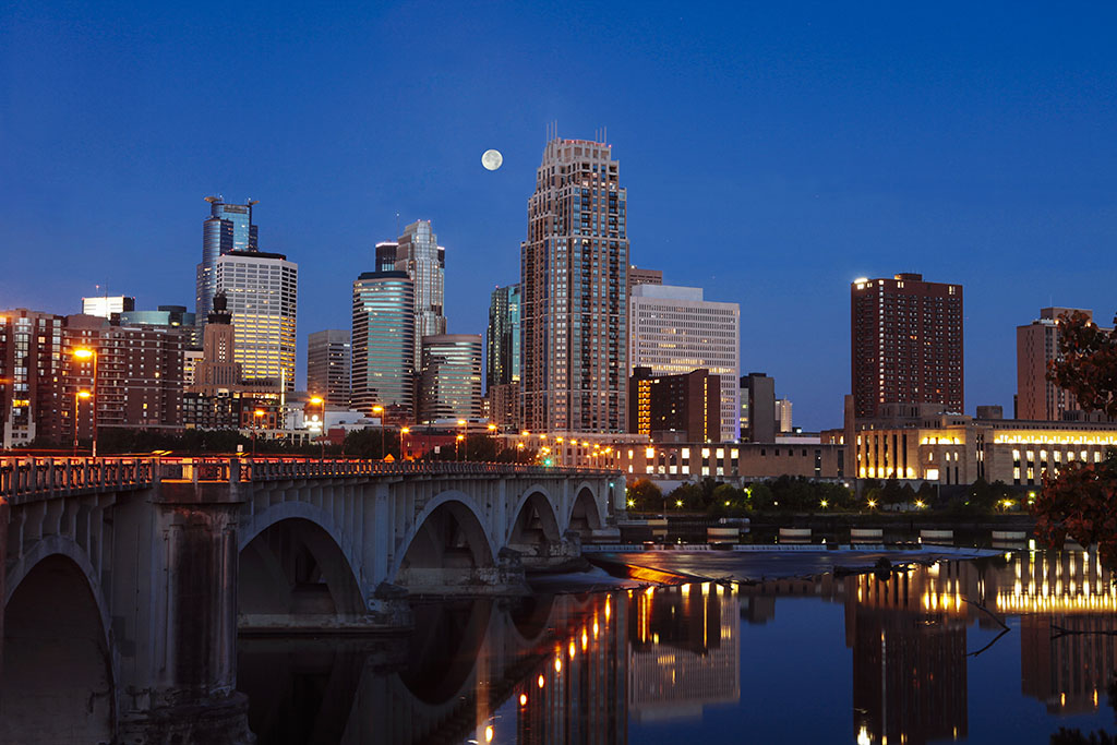 Minneapolis Minnesota skyline in the early morning with the full moon, landscape, Mississippi River, Editorial food Photographers