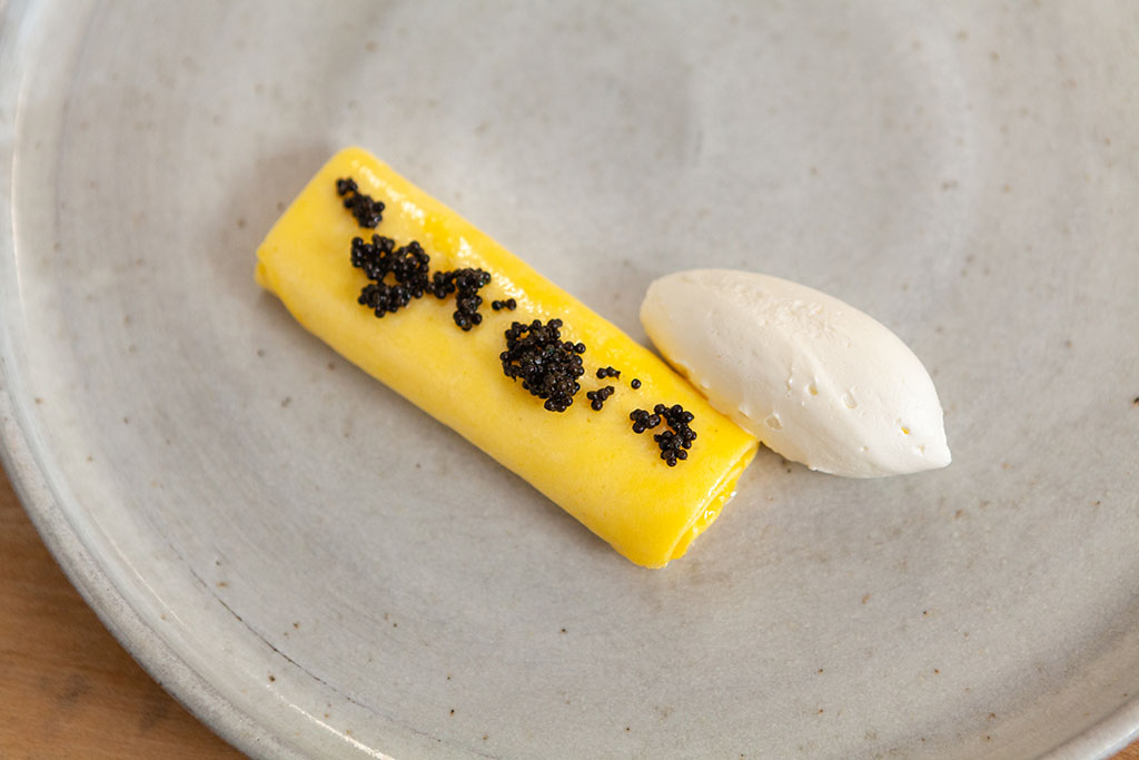 Rolled egg and caviar with cream French omelette at a Twin Cities restaurant. Chicago restaurant food photographers.